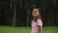 Preadolescent girl making dance moves outdoors