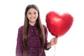 Cheerful lovely romantic teen girl hold red heart balloon, symbol of love for valentines day  on white Royalty Free Stock Photo
