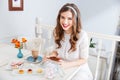 Cheerful lovely young woman eating dessert in cafe Royalty Free Stock Photo