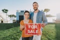 Pleasant nice couple selling their modern house Royalty Free Stock Photo