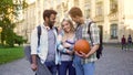 Cheerful male students flirting and hugging pretty female, pick-up tricks Royalty Free Stock Photo