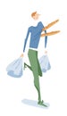 Cheerful man carrying baguettes and shopping bags Royalty Free Stock Photo