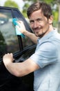cheerful man cleaning car Royalty Free Stock Photo