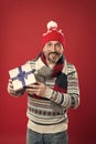 Cheerful man congratulate with xmas. buy new year presents and gifts. winter holiday surprise. mature man warm knitted