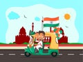 Cheerful Man driving Auto Taxi with Indian Flag and Tricolor Balloons in Front of Red Fort.