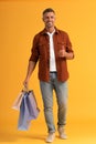 cheerful man holding colorful shopping bags Royalty Free Stock Photo