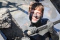 A man laughs while uphill in a therapeutic mud lake