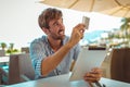 Cheerful man paying for order with credit card in cafe Royalty Free Stock Photo