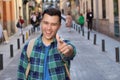 Cheerful man pointing at camera outdoors Royalty Free Stock Photo