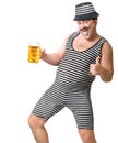 Cheerful man in a striped suit with a glass of cold foamy beer.