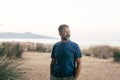 Cheerful man walking outdoor happy looking on camera. Scenic travel destination background with beach and ocean island. Clear Royalty Free Stock Photo