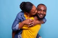 Cheerful man and woman having fun with piggyback ride Royalty Free Stock Photo