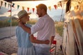 Cheerful man and woman Near Modern Camper Van In Camping at evening Royalty Free Stock Photo