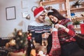 Man and woman opens Christmas gift at home Royalty Free Stock Photo