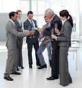 Cheerful manager serving Champagne to his team Royalty Free Stock Photo