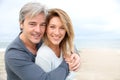 Cheerful mature couple on the beach