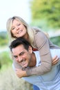 Cheerful mature couple having fun putdoors