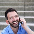 Cheerful mature man using cellphone and laughing Royalty Free Stock Photo