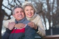 cheerful mature married couple sitting on park bench Royalty Free Stock Photo