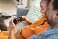 Pregnant black couple watching ultrasound on phone Royalty Free Stock Photo