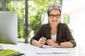 Cheerful mature woman business consultant working at office Royalty Free Stock Photo