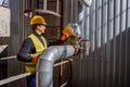 Joyful male engineer in safety helmet working at factory Royalty Free Stock Photo