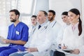 Cheerful medical team listening to new information Royalty Free Stock Photo