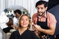 Man makeup artist applying cosmetics for woman Royalty Free Stock Photo