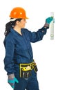 Cheerful mid adult worker woman measure