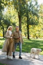 cheerful middle aged couple holding coffee Royalty Free Stock Photo