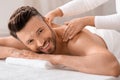 Cheerful middle aged man attending spa salon Royalty Free Stock Photo