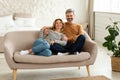 Cheerful Middle Aged Spouses Hugging Sitting On Sofa At Home Royalty Free Stock Photo