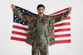 Cheerful military guy with flag of the US on white Royalty Free Stock Photo