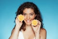 Cheerful millennial european lady hold orange, enjoy beauty care at home