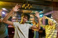 Cheerful mixed race young man having fun, dancing with friends at party in the bar Royalty Free Stock Photo