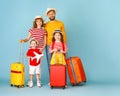 Cheerful modern family with suitcases Royalty Free Stock Photo