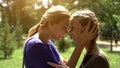 Cheerful mother and daughter happy for getting credit in bank, social insurance