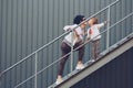 Cheerful mother and daughter having fun in city