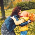 Cheerful mother and son outdoors. Happy family having fun. Royalty Free Stock Photo