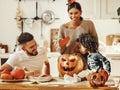 Happy multi ethnic family preparing for Halloween celebration
