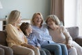 Cheerful multi generational women laughing, enjoy communication at home Royalty Free Stock Photo