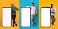 Cheerful multicultural men posing with huge smartphones, mockup