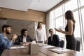 Cheerful multiethnic business professional colleagues working on project together Royalty Free Stock Photo