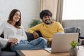 cheerful multiethnic couple of podcasters sitting Royalty Free Stock Photo