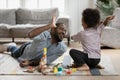 Cheerful multiracial family having fun on weekend. Royalty Free Stock Photo