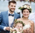 Cheerful newlyweds at beach wedding ceremony Royalty Free Stock Photo