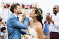 Cheerful newlyweds at beach wedding ceremony Royalty Free Stock Photo