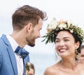 Cheerful newlyweds at beach wedding ceremony Royalty Free Stock Photo