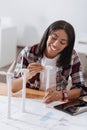 Cheerful nice woman making windmill models Royalty Free Stock Photo