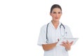 Cheerful nurse using her tablet Royalty Free Stock Photo